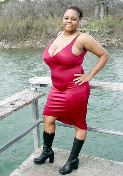 Black mature woman shows huge breasts