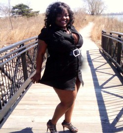Wild black fat woman in a short skirt.